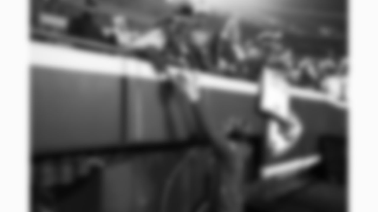 Kansas City Chiefs linebacker Cooper McDonald (59) autographs a young fan's helmet prior to a week 17 NFL football game against the Denver Broncos, Thursday, December 25, 2025 in Kansas City, MO.