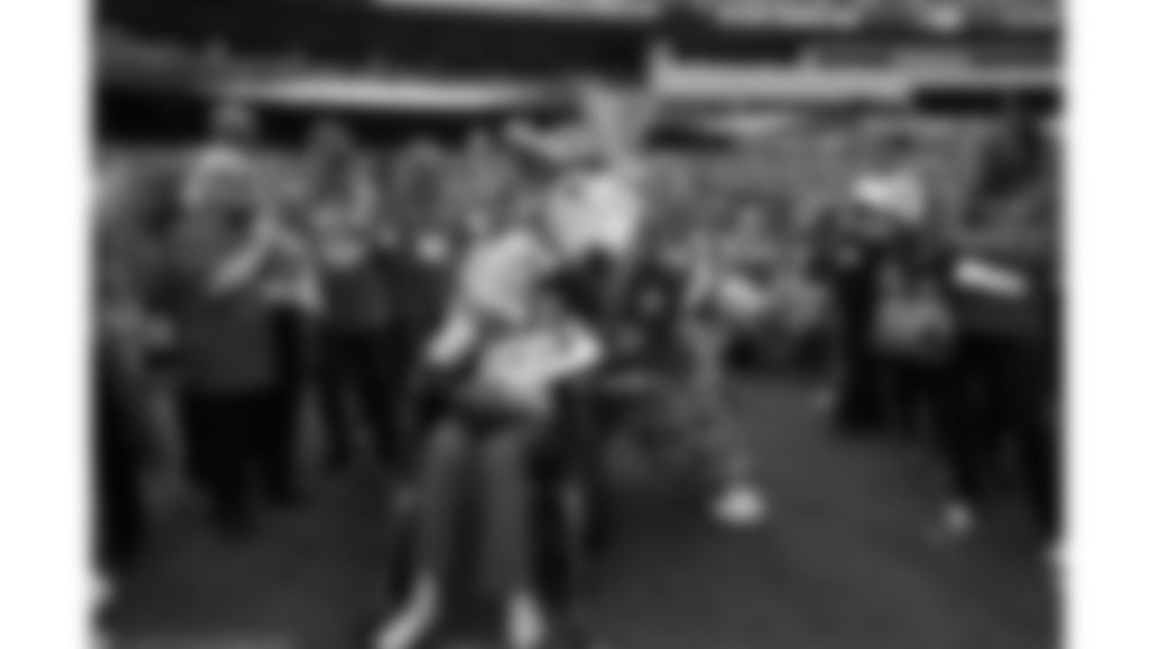 KC Wolf with Melba Mills during the game between the Baltimore Ravens and the Kansas City Chiefs at Arrowhead Stadium.