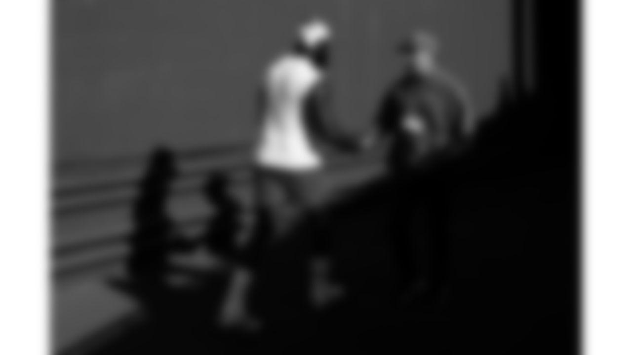 Kansas City Chiefs defensive end Charles Omenihu (90) shakes Defensive Line Coach Joe Cullen's hand in the tunnel prior to a week 9 NFL football game against the Buffalo Bills, Sunday, November 2, 2025 in Buffalo, NY.