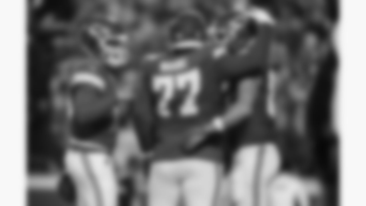 Kansas City Chiefs offensive lineman Jaylon Moore (77), quarterback Patrick Mahomes (15) and  tight end Travis Kelce (87) celebrate a touchdown during a week 8 NFL Football game against the Washington Commanders on Monday, October 27, 2025 in Kansas City, MO.