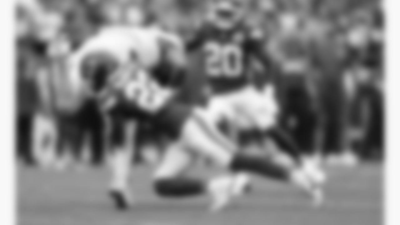 Kansas City Chiefs cornerback Trent McDuffie (22) tackles Philadelphia Eagles quarterback Jalen Hurts (1) during the week 2 NFL football game, Sunday, September 14, 2025 in Kansas City, MO.