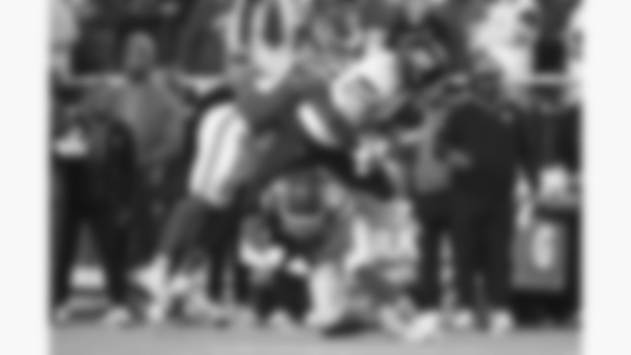 Kansas City Chiefs cornerback Chris Roland-Wallace (30) and defensive back Chamarri Conner (27) make a during a week 8 NFL Football game against the Washington Commanders on Monday, October 27, 2025 in Kansas City, MO.