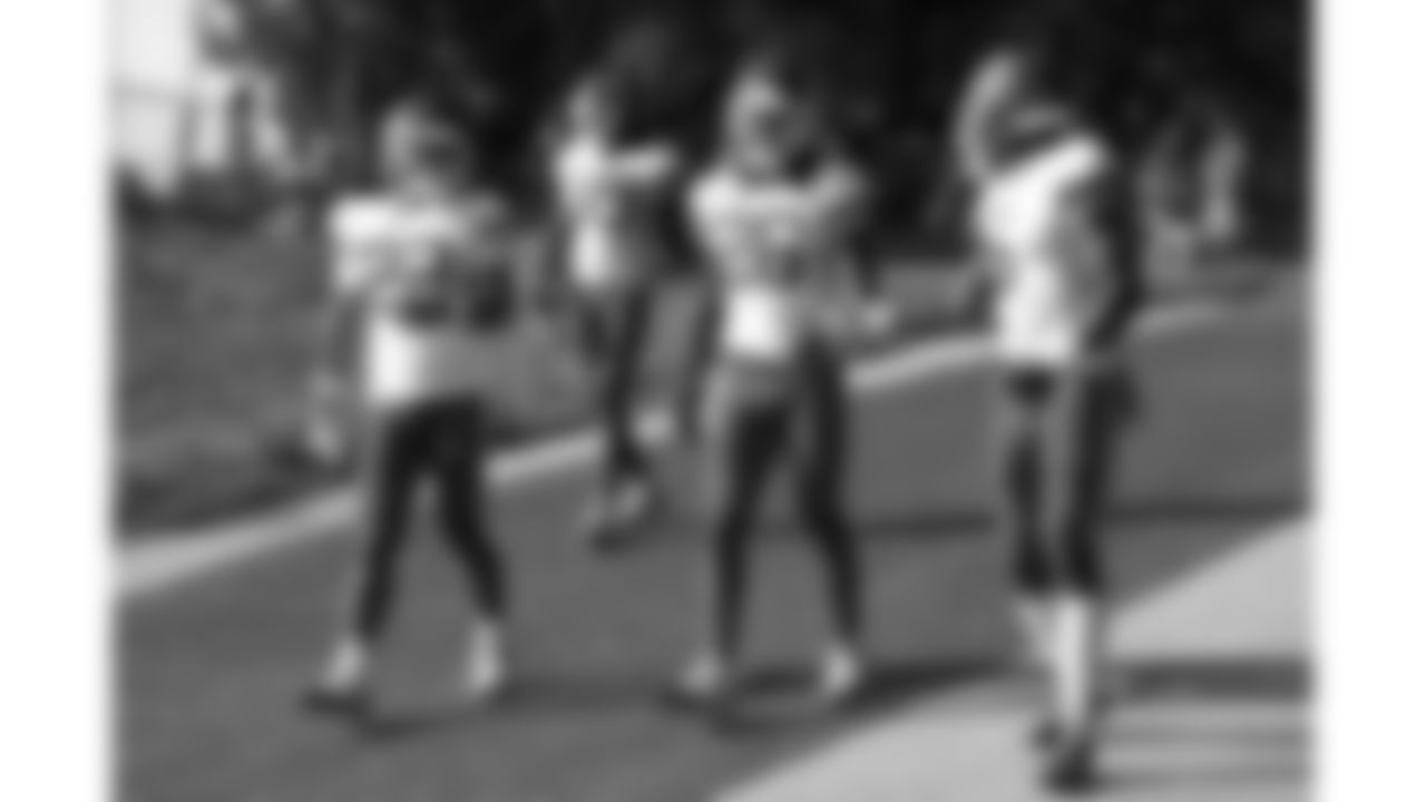 Kansas City Chiefs cornerback Trent McDuffie (22), safety Deon Bush (26) and safety Bryan Cook (6) arrive at day 6 of training camp practice on Monday, July 28, 2025.