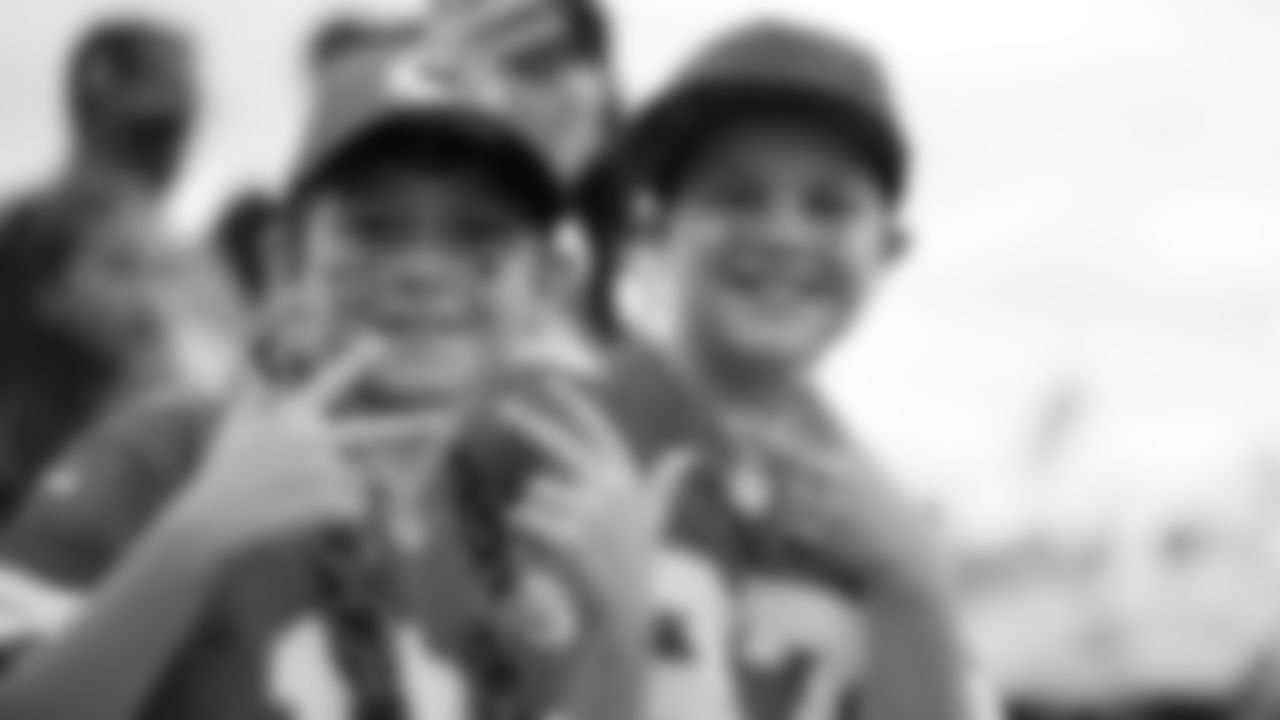 Kansas City Chiefs fans pose for a photo prior to the week 6 NFL football game against the Detroit Lions, Sunday, October 12, 2025 in Kansas City, MO.