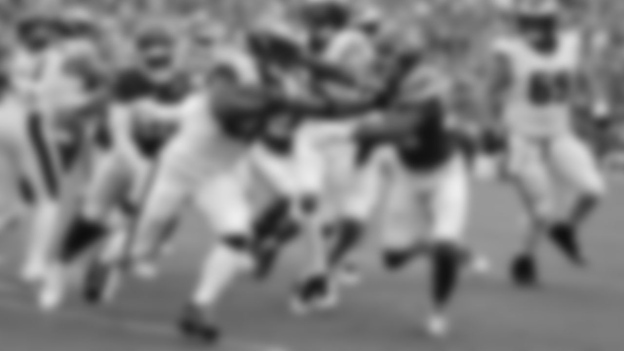 Philadelphia Eagles running back Saquon Barkley (26) stiff arms Kansas City Chiefs cornerback Jaylen Watson (35) while running the ball during the week 2 NFL football game, Sunday, September 14, 2025 in Kansas City, MO.