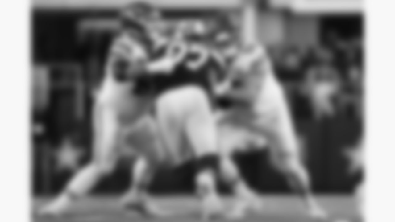 Kansas City Chiefs center Creed Humphrey (52) and offensive lineman Mike Caliendo block a defender during a week 13 NFL Football game against the Dallas Cowboys on Thursday, November 27, 2025 in Dallas, Texas.