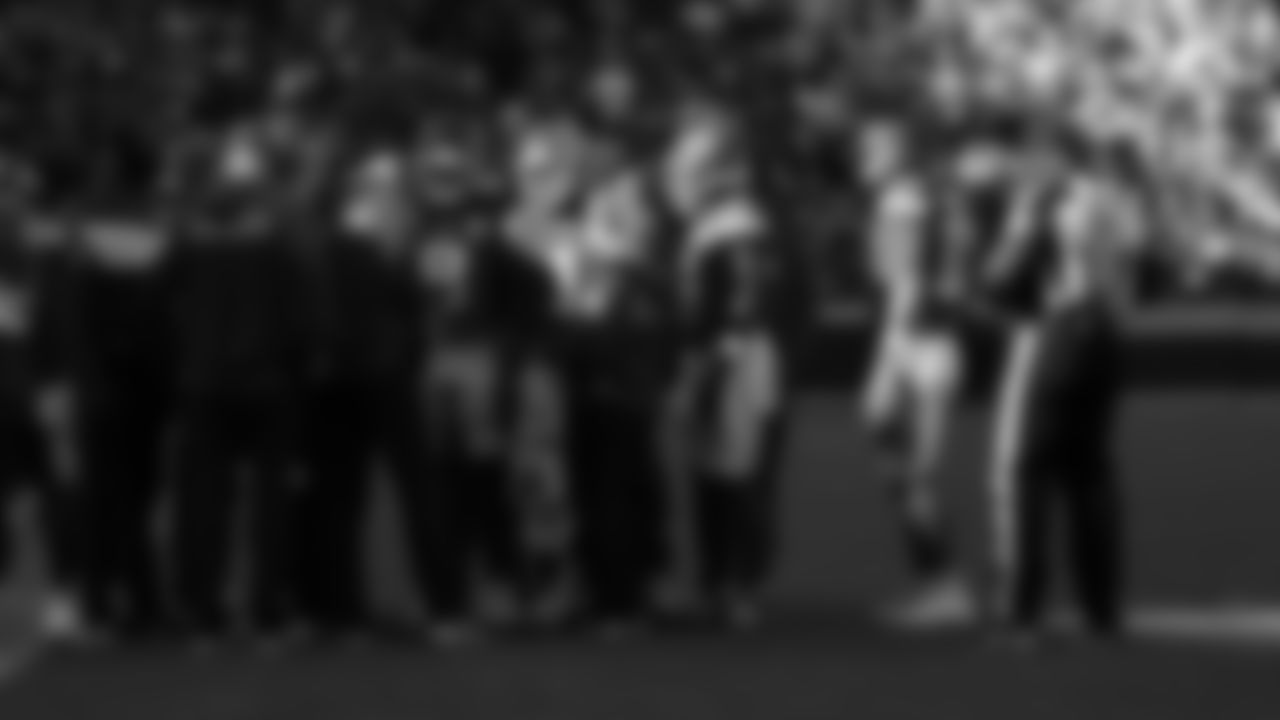 Kansas City Chiefs offense talks on the sideline with the coaches during a week 12 NFL Football game against the Indianapolis Colts on Sunday, November 23, 2025 in Kansas City, MO