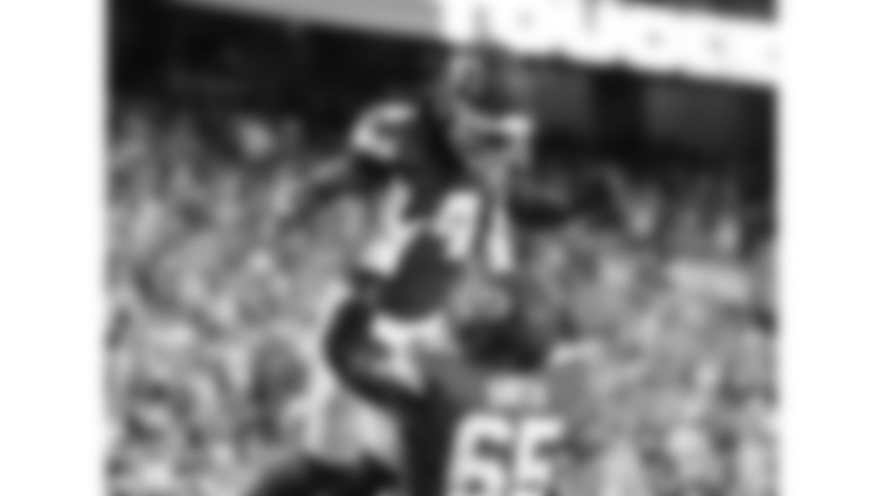 Kansas City Chiefs offensive lineman Trey Smith (65) lifts wide receiver Rashee Rice (4) in the end zone during a preseason week 3 NFL football game against the Chicago Bears, Friday, August 22, 2025 in Kansas City, MO.