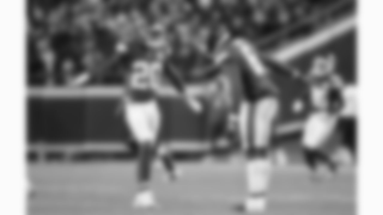 Kansas City Chiefs defensive back Nohl Williams (20) and safety Bryan Cook (6) high five during a week 14 NFL football game against the Houston Texans, Sunday, December 7, 2025 in Kansas City, MO.