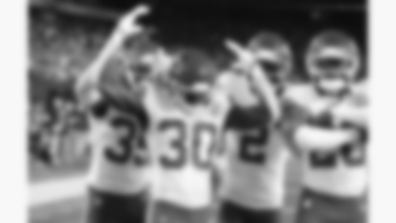 Kansas City Chiefs cornerback Jaylen Watson (35), cornerback Chris Roland-Wallace (30), cornerback Joshua Williams (2) and defensive back Nohl Williams (20) celebrate in the end zone after getting an interception during the week 3 NFL football game against the New York Giants, Sunday, September 21, 2025 in East Rutherford, NJ.