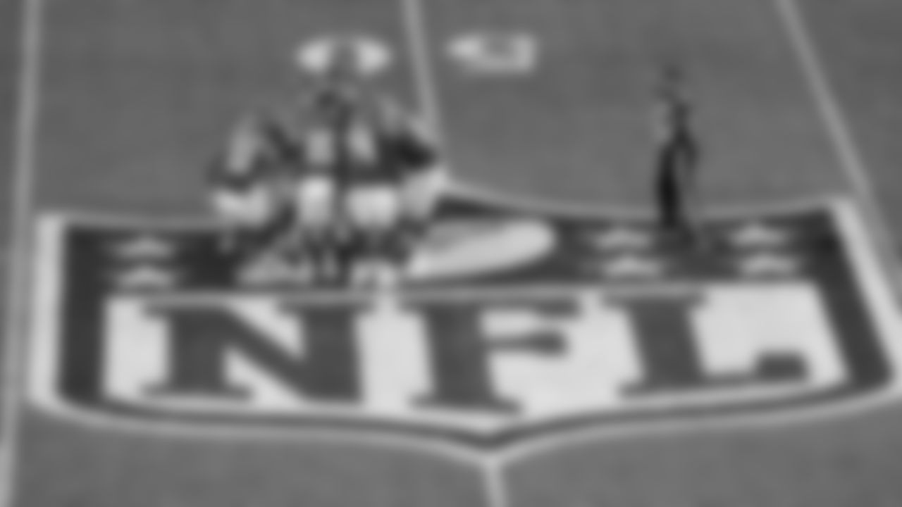 Kansas City Chiefs quarterback Patrick Mahomes (15) leads the offense in a group huddle over the NFL Shield midfield logo during an NFL football game against the Miami Dolphins, Sunday, Nov. 5, 2023, in Frankfurt, Germany.