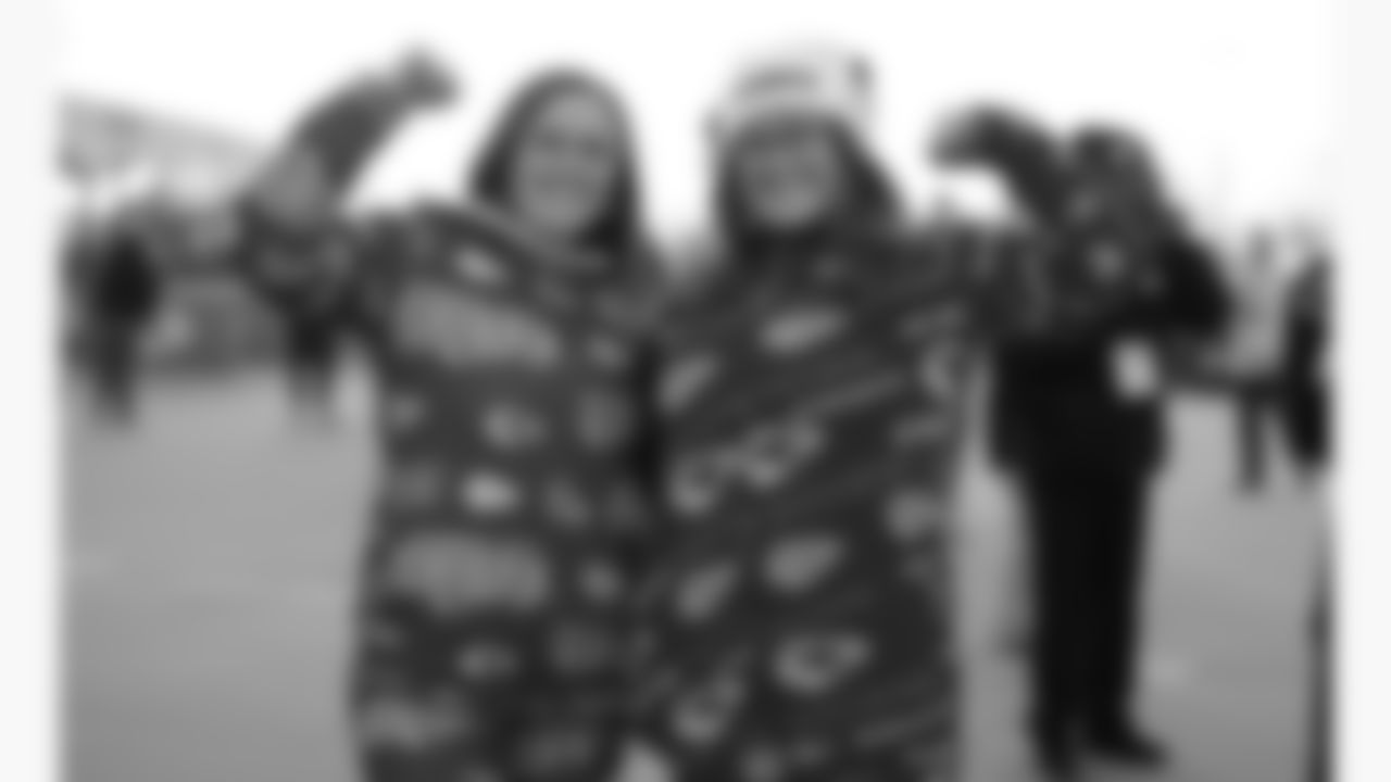 Kansas City Chiefs fans pose for a photo prior to a week 14 NFL football game against the Houston Texans, Sunday, December 7, 2025 in Kansas City, MO.