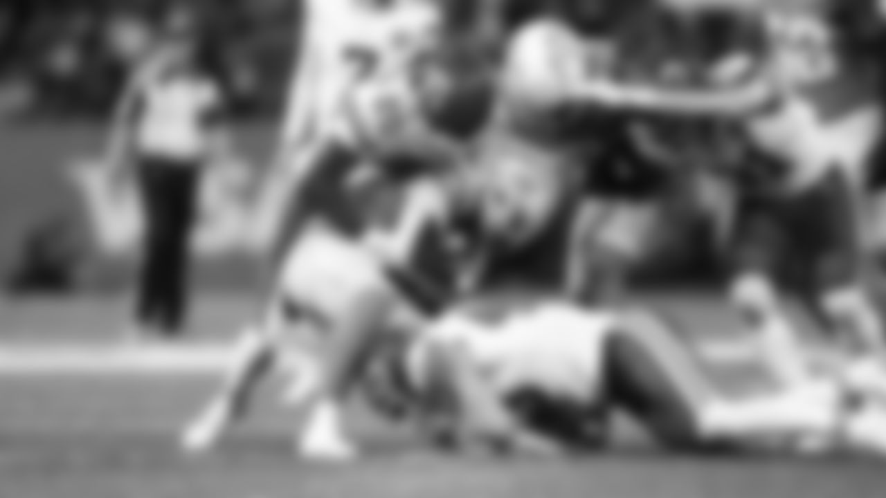 Kansas City Chiefs linebacker Jack Cochrane (43) and defensive back Nohl Williams (20) tackle a Los Angeles receiver during a week 1 NFL football game against the Los Angeles Chargers at Arena Corinthians in São Paulo, Brazil on September 5, 2025.