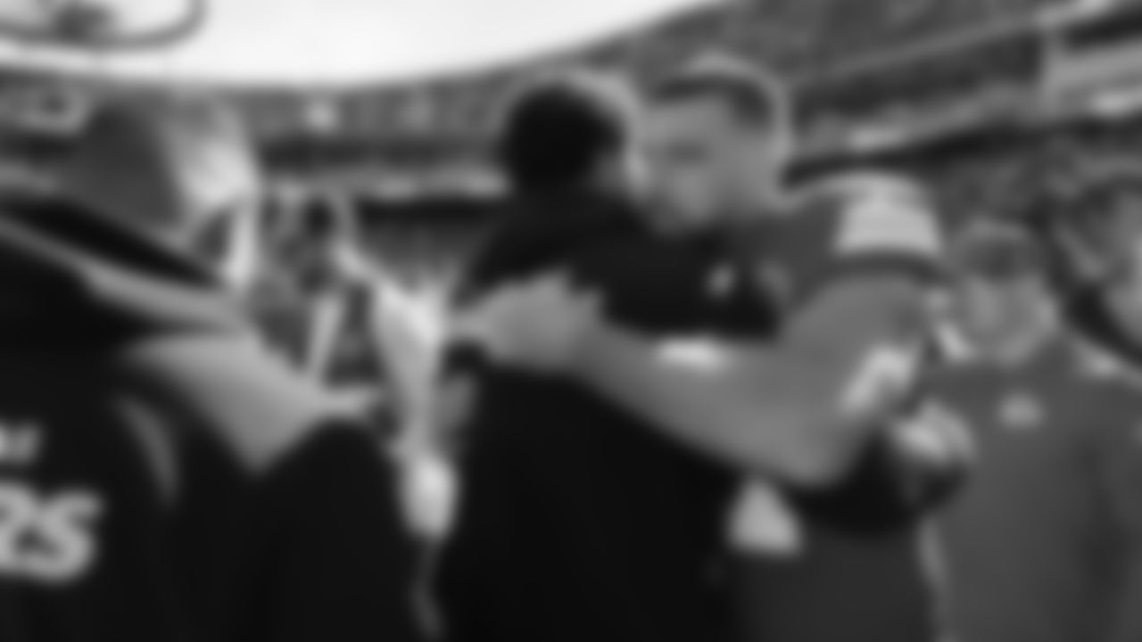 Kansas City Chiefs tight end Travis Kelce (87) hugs a Las Vegas Raiders player after a week 7 NFL Football game against the Las Vegas Raiders on Sunday, October 19, 2025 in Kansas City, MO.