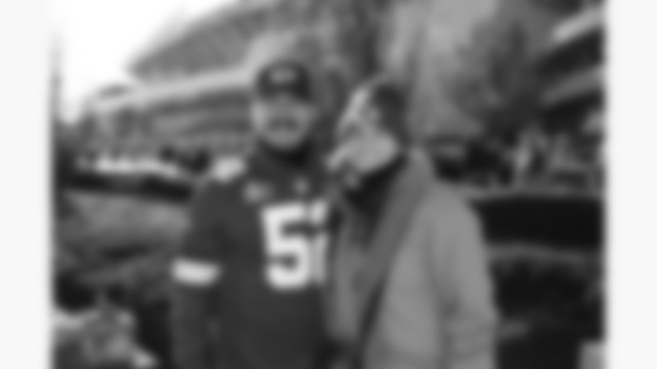 Kansas City Chiefs fans pose prior to a week 15 NFL football game against the Los Angeles Chargers, Sunday, December 14, 2025 in Kansas City, MO.