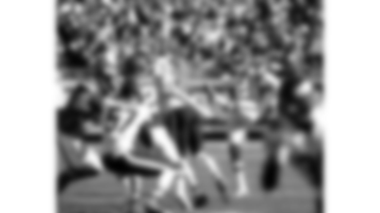 Kansas City Chiefs punter Dustin Colquitt (2) punts the ball to the opponent.