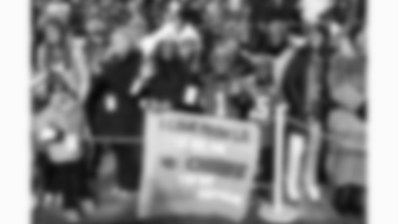 Kansas City Chiefs fans hold a sign on the sidelines prior to a week 14 NFL football game against the Houston Texans, Sunday, December 7, 2025 in Kansas City, MO.