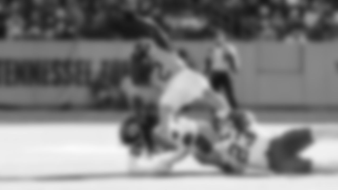 Kansas City Chiefs linebacker Nick Bolton (32) and middle linebacker Drue Tranquill (23) make a tackle during a week 16 NFL Football game against the Tennessee Titans on Sunday, December 21, 2025 in Nashville, Tennessee.