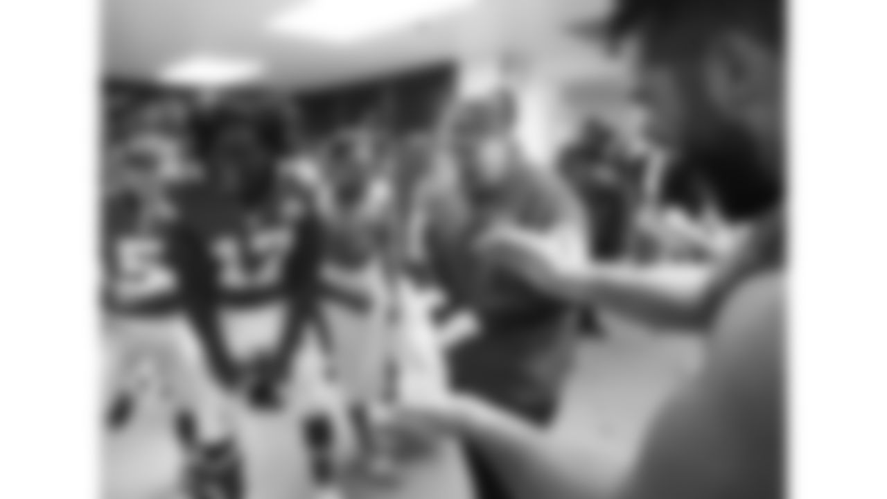 Kansas City Chiefs head coach Andy Reid celebrates with his team in the locker room after the 2015 game against the Detroit Lions at Wembley Stadium in London.