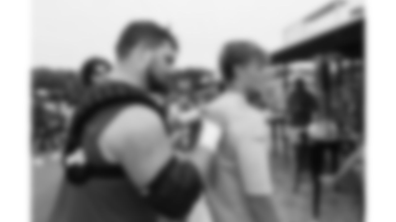 Kansas City Chiefs offensive lineman Michael Caliendo (66) signs a fans shirt after day 11 of Training Camp practice on Sunday, August 3, 2025.