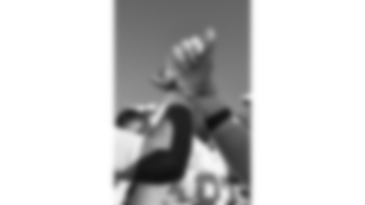 Kansas City Chiefs quarterback Gardner Minshew (17) and defensive tackle Chris Jones (95) raise their hands in the huddle prior to a week 16 NFL Football game against the Tennessee Titans on Sunday, December 21, 2025 in Nashville, Tennessee.