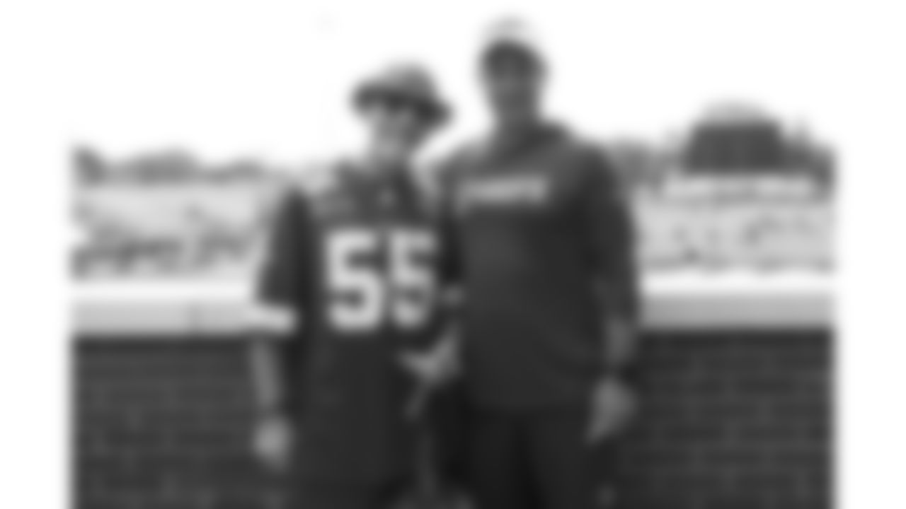 Kansas City Chiefs General Manager Brett Veach and a fan during The Season Ticket Member Pancake Breakfast before day 14 of training camp on Thursday, August 7, 2025.