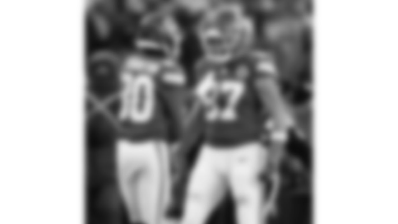 Kansas City Chiefs wide receiver Tyquan Thornton (80) and tight end Travis Kelce (87) celebrate during a week 15 NFL football game against the Los Angeles Chargers, Sunday, December 14, 2025 in Kansas City, MO.