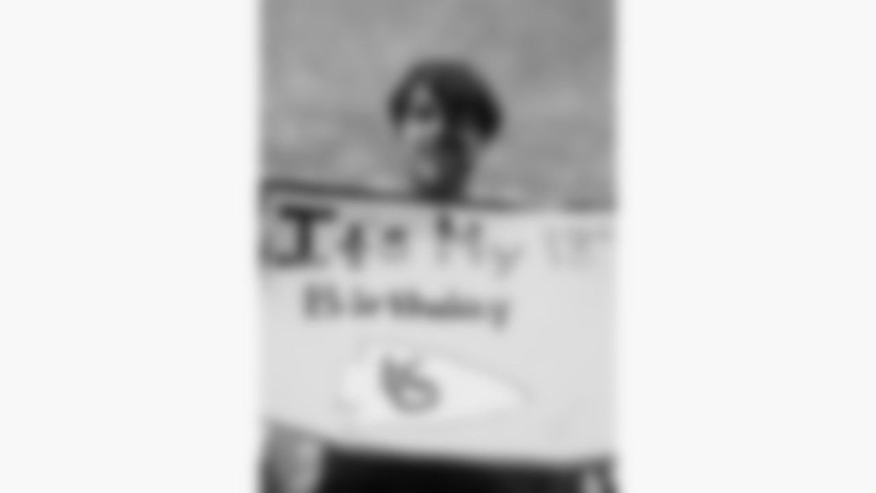 A Kansas City Chiefs fan poses with a sign prior to a week 16 NFL football game against the Tennessee Titans, Sunday, December 21, 2025 in Nashville, TN.