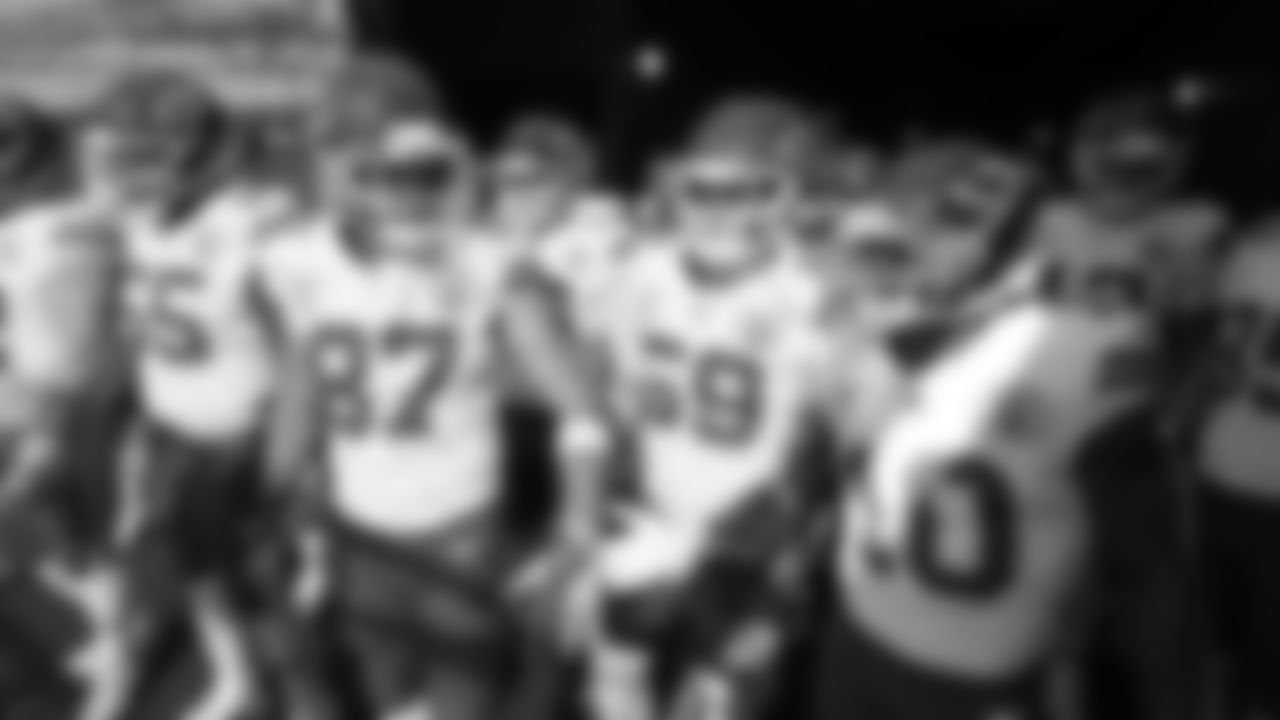 Kansas City Chiefs tight end Travis Kelce (87) and running back Isiah Pacheco (10) high five prior to a week 16 NFL Football game against the Tennessee Titans on Sunday, December 21, 2025 in Nashville, Tennessee.