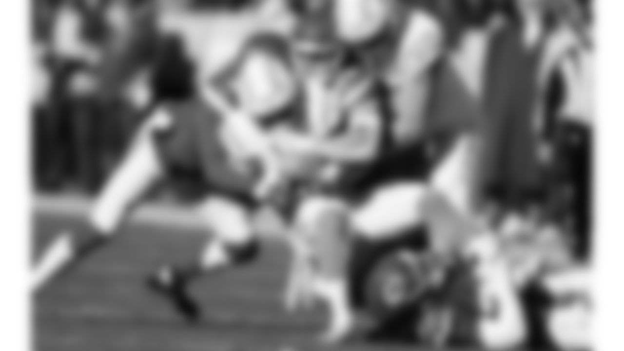 Safety Bryan Cook (6), and Kansas City Chiefs linebacker Leo Chenal (54) make a tackle during an NFL week 15 matchup against the Los Angeles Chargers, Sunday December 14, 2025.