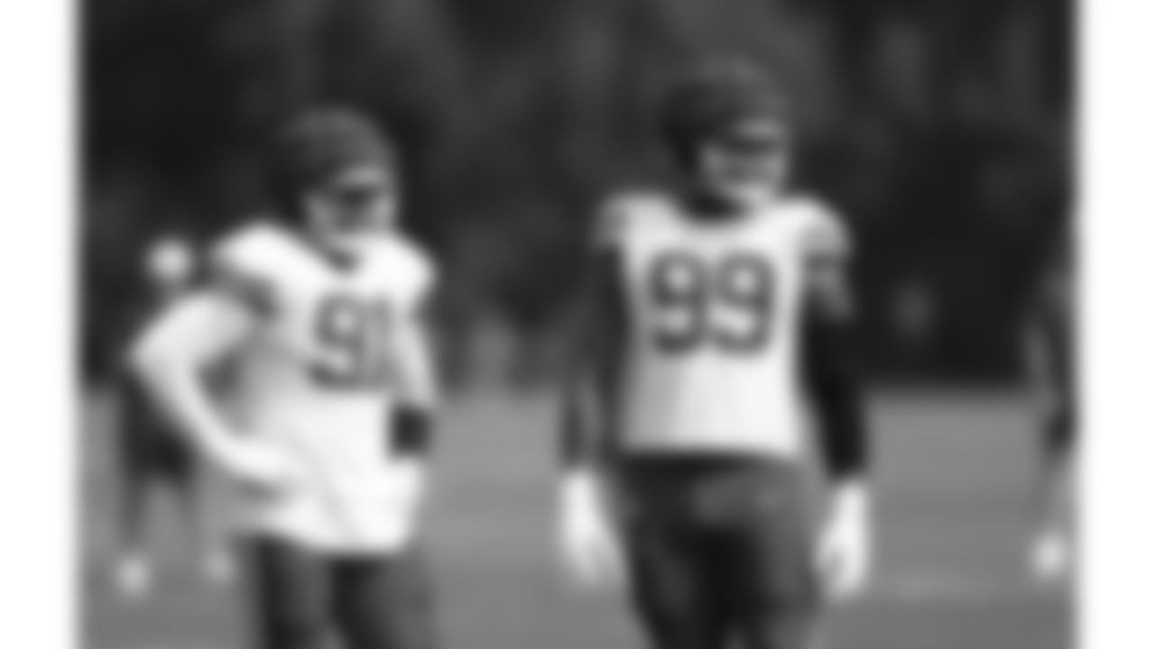 Kansas City Chiefs defensive end Felix Anudike-Uzomah (91) and defensive lineman Jerry Tillery (99) during day 9 of training camp practice on Friday, August 1, 2025.