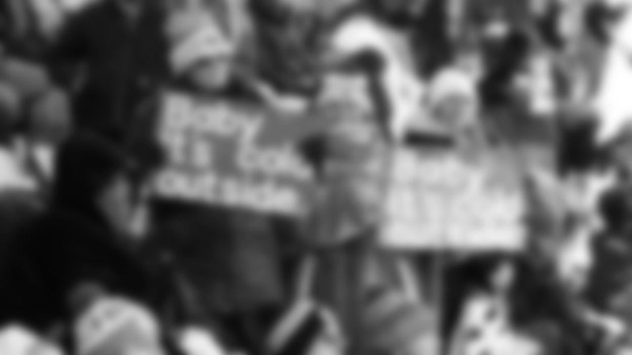 Kansas City Chiefs fans hold signs during a week 15 NFL football game against the Los Angeles Chargers, Sunday, December 14, 2025 in Kansas City, MO.