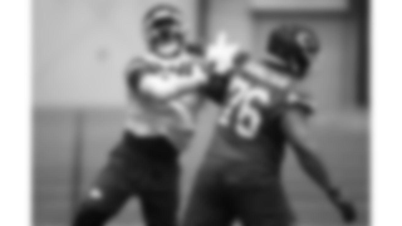 Kansas City Chiefs tackle Kingsley Suamataia (76) and defensive end Charles Omenihu (90) during a week 16 practice on Thursday, December 18, 2025 in Kansas City, MO.