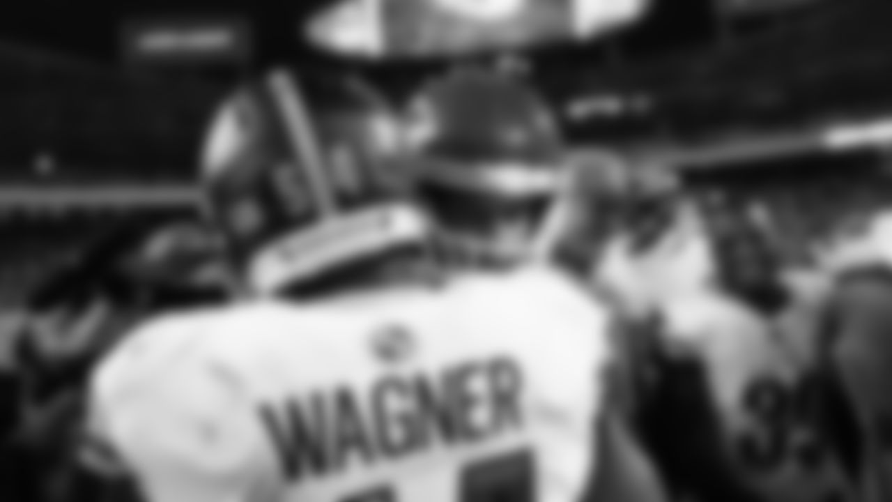 Kansas City Chiefs quarterback Patrick Mahomes (15) hugs Washington Commanders linebacker Bobby Wagner (54) after a week 8 NFL Football game against the Washington Commanders on Monday, October 27, 2025 in Kansas City, MO.