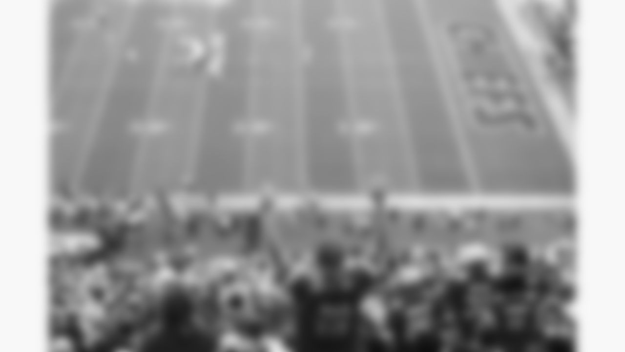 A Kansas City Chiefs fan raises his arms during the week 4 NFL football game against the Baltimore Ravens, Sunday, September 28, 2025 in Kansas City, MO.