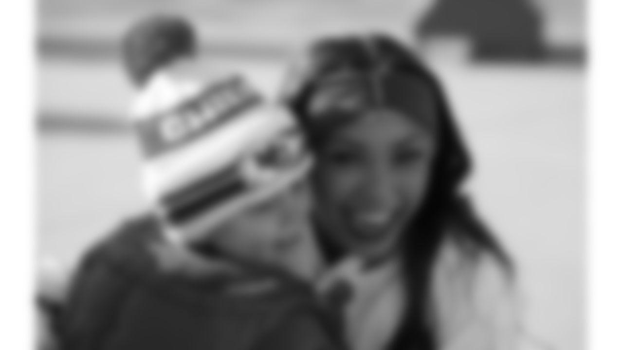 Kansas City Chiefs Cheerleaders with a young fan prior to a week 15 NFL Football game against the Los Angeles Chargers on Sunday, December 14, 2025 in Kansas City, MO.