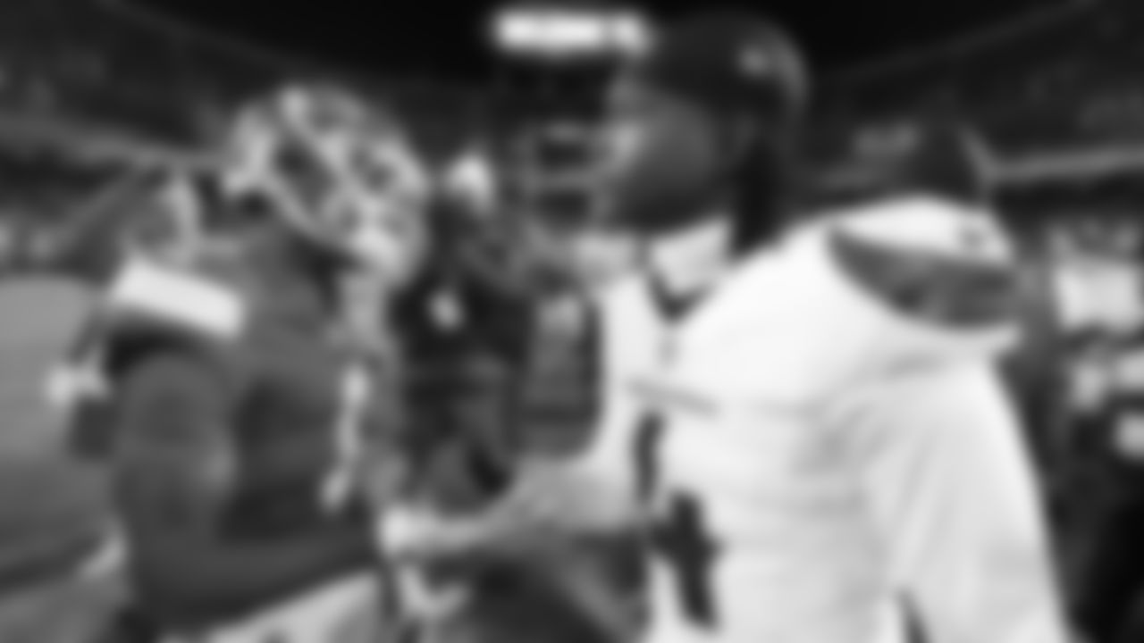 Kansas City Chiefs wide receiver Xavier Worthy (1) talks with Houston Texans cornerback Kamari Lassiter (4) after an NFL week 14 matchup against the Houston Texans, Sunday December 7, 2025.