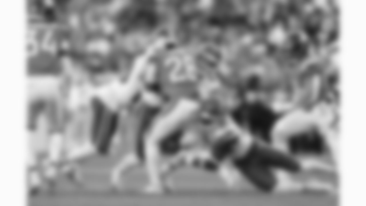 Kansas City Chiefs defensive back Nohl Williams (20), linebacker Jack Cochrane (43) and cornerback Chris Roland-Wallace (30) tackle Denver Broncos running back Tyler Badie (28) during a week 11 NFL football game, Sunday, November 16, 2025 in Denver, CO.