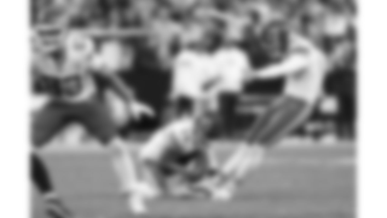 Kansas City Chiefs punter Matt Araiza (14) holds the ball while kicker Harrison Butker (7) kicks a field goal during a week 18 NFL football game against the Las Vegas Raiders, Sunday, January 4, 2026 in Las Vegas, NV.