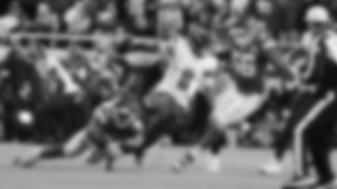 Kansas City Chiefs defensive end Charles Omenihu (90) trips up Washington Commanders quarterback Marcus Mariota (8) during a week 8 NFL Football game against the Washington Commanders on Monday, October 27, 2025 in Kansas City, MO.