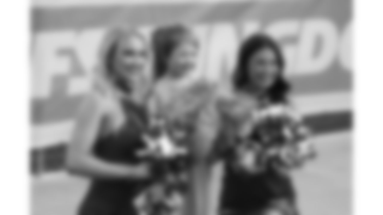 Chiefs Cheerleaders pose with fans during Day 1 of training camp practice on Tuesday, July 22, 2025.