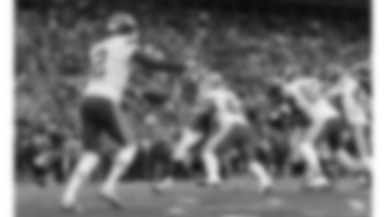 Kansas City Chiefs punter Dustin Colquitt (2) punts the ball during a 2017 NFL game against the Denver Broncos.