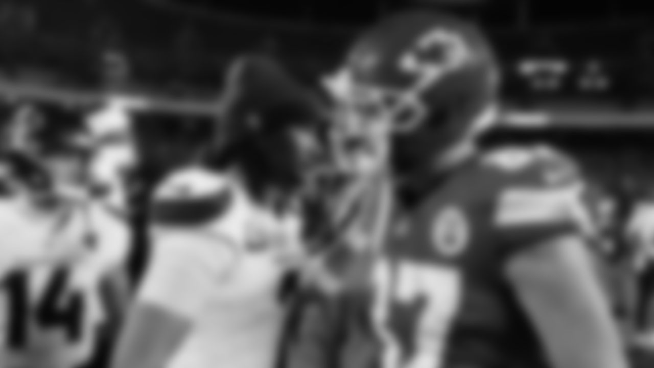 Kansas City Chiefs tight end Travis Kelce (87) talks with Houston Texans quarterback C.J. Stroud (7) after an NFL week 14 matchup against the Houston Texans, Sunday December 7, 2025.