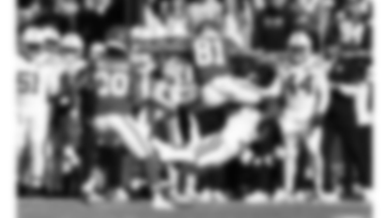 Kansas City Chiefs wide receiver Nikko Remigio (81) hurdles over a defender during a week 12 NFL football game against the Indianapolis Colts, Sunday, November 23, 2025 in Kansas City, MO.