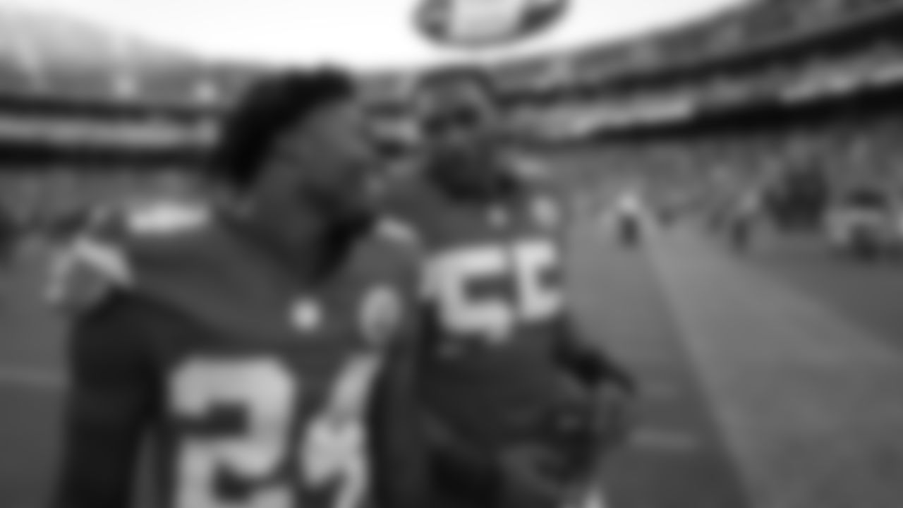 Kansas City Chiefs running back Brashard Smith (24) and defensive tackle Omarr Norman-Lott (55) walk off the field together following a win during the week 4 NFL football game against the Baltimore Ravens, Sunday, September 28, 2025 in Kansas City, MO.