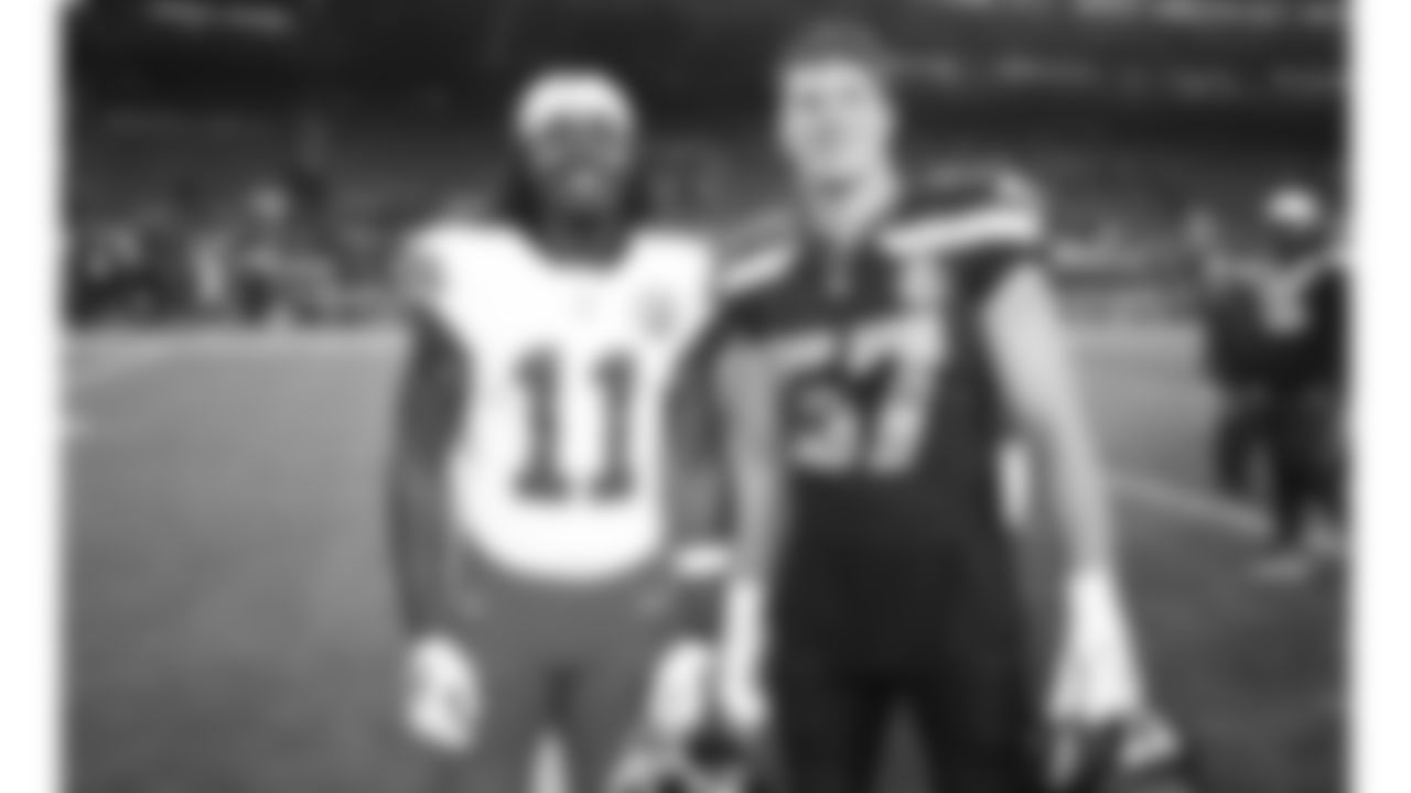 Kansas City Chiefs wide receiver Jalen Royals (11) poses for a photo with Seattle Seahawks linebacker Connor O'Toole (57) following a preseason week 2 NFL football game, Friday, August 15, 2025 in Seattle, WA.