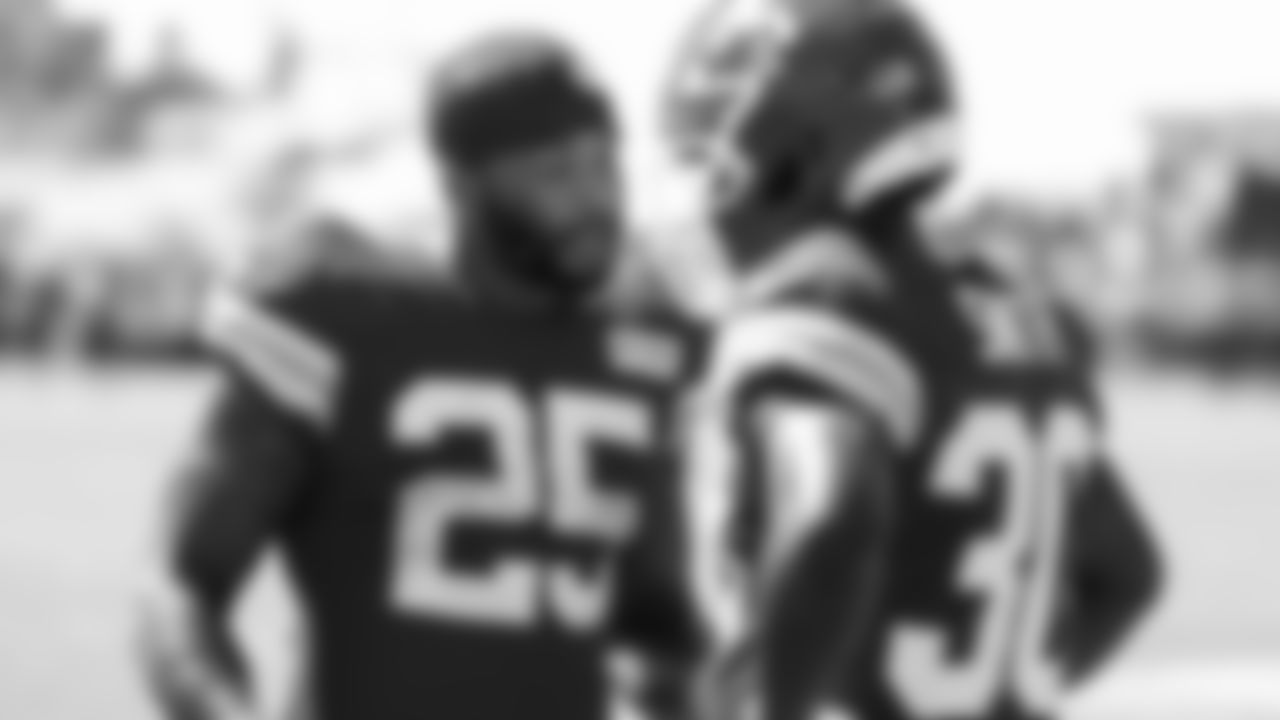 Kansas City Chiefs running back Elijah Mitchell (25) speaks with rookie running back Brashard Smith (30) during day 7 of training camp practice on Tuesday, July 29, 2025.