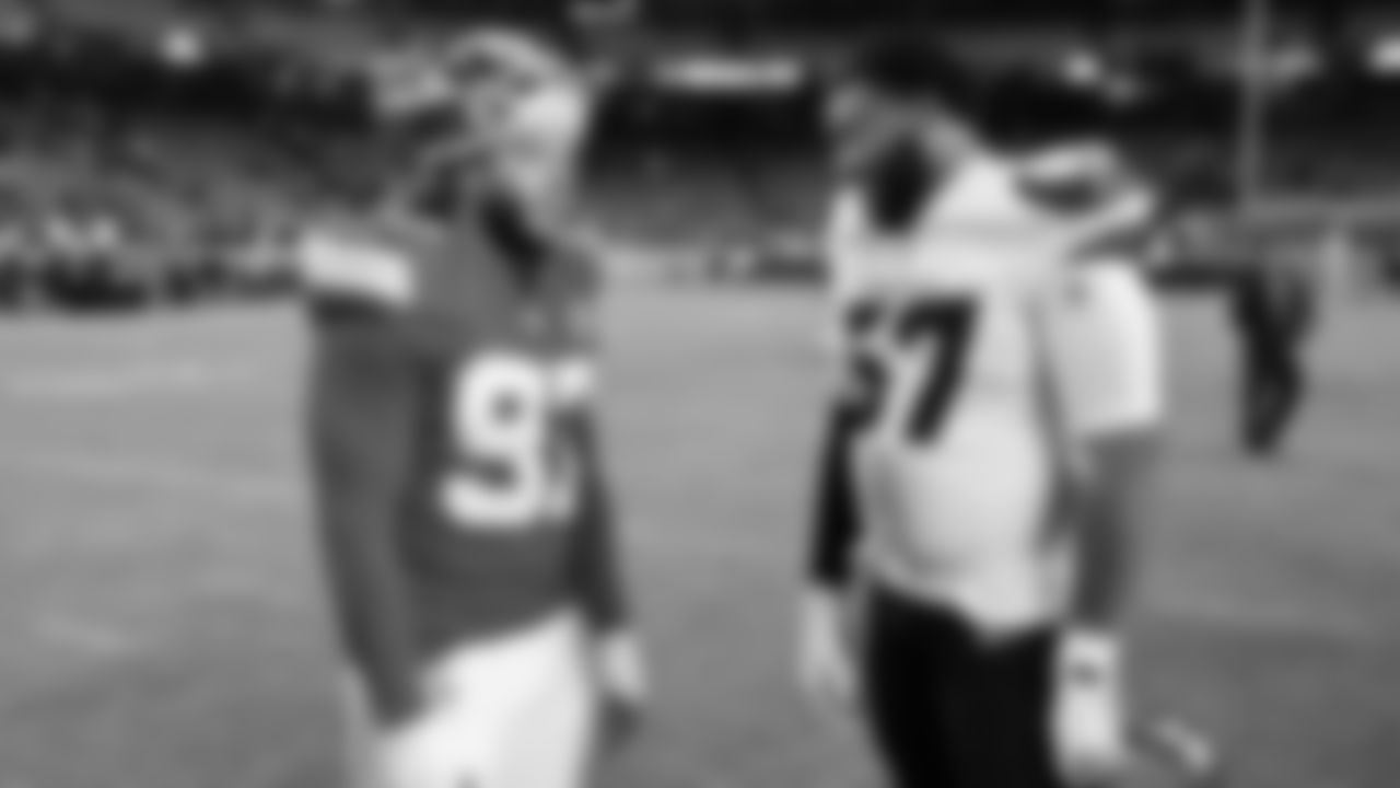 Kansas City Chiefs defensive end Ashton Gillotte (97) talks with Houston Texans tackle Blake Fisher (57) after an NFL week 14 matchup against the Houston Texans, Sunday December 7, 2025.