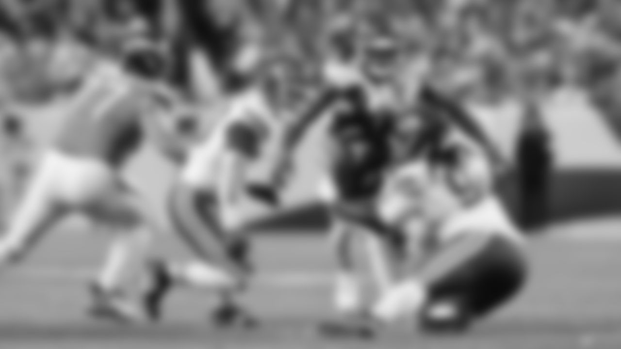 Kansas City Chiefs defensive end Charles Omenihu (90) tackles a Broncos ball carrier during a week 11 NFL Football game against the Denver Broncos on Sunday, November 16, 2025 in Denver, Colorado.