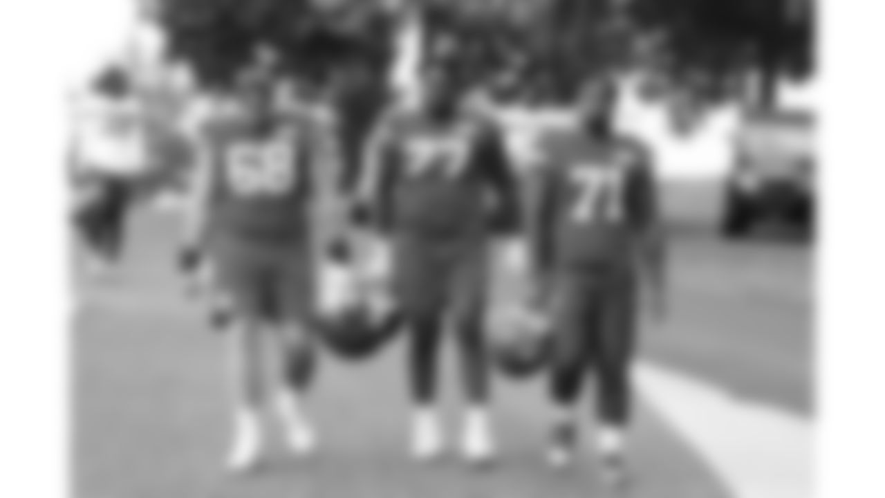 Kansas City Chiefs offensive lineman Joey Lombard (68), offensive lineman Jaylon Moore (77), and tackle Josh Simmons (71) arrive at day 11 of training camp practice on Sunday, August 3, 2025.